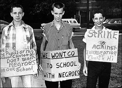  students holding racial segregation signs